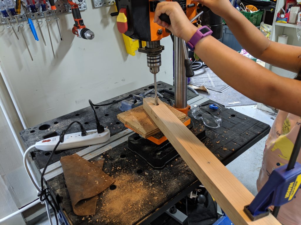 Drilling holes for a DIY wooden ladder bookcase