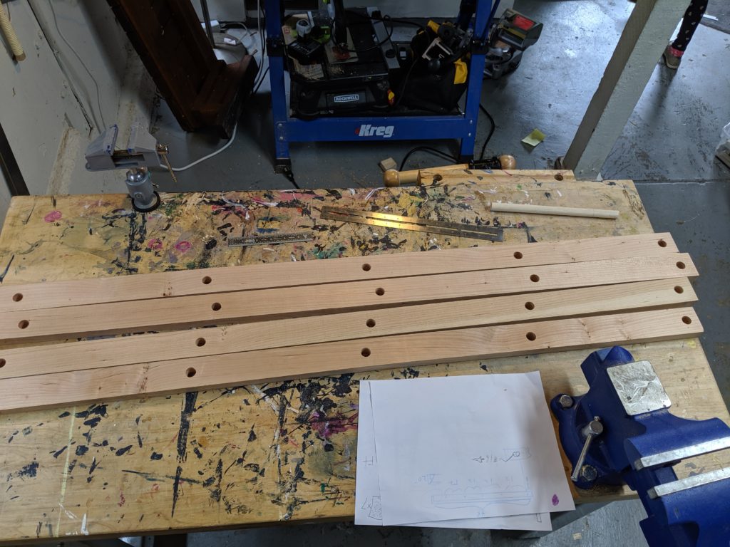 All the holes align for our DIY wooden ladder bookcase