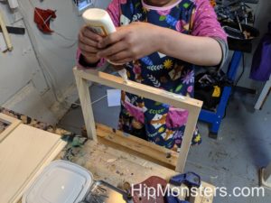 Assembling our DIY wooden cabinet.