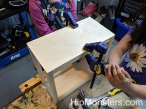 Clamping our DIY wooden cabinet together.